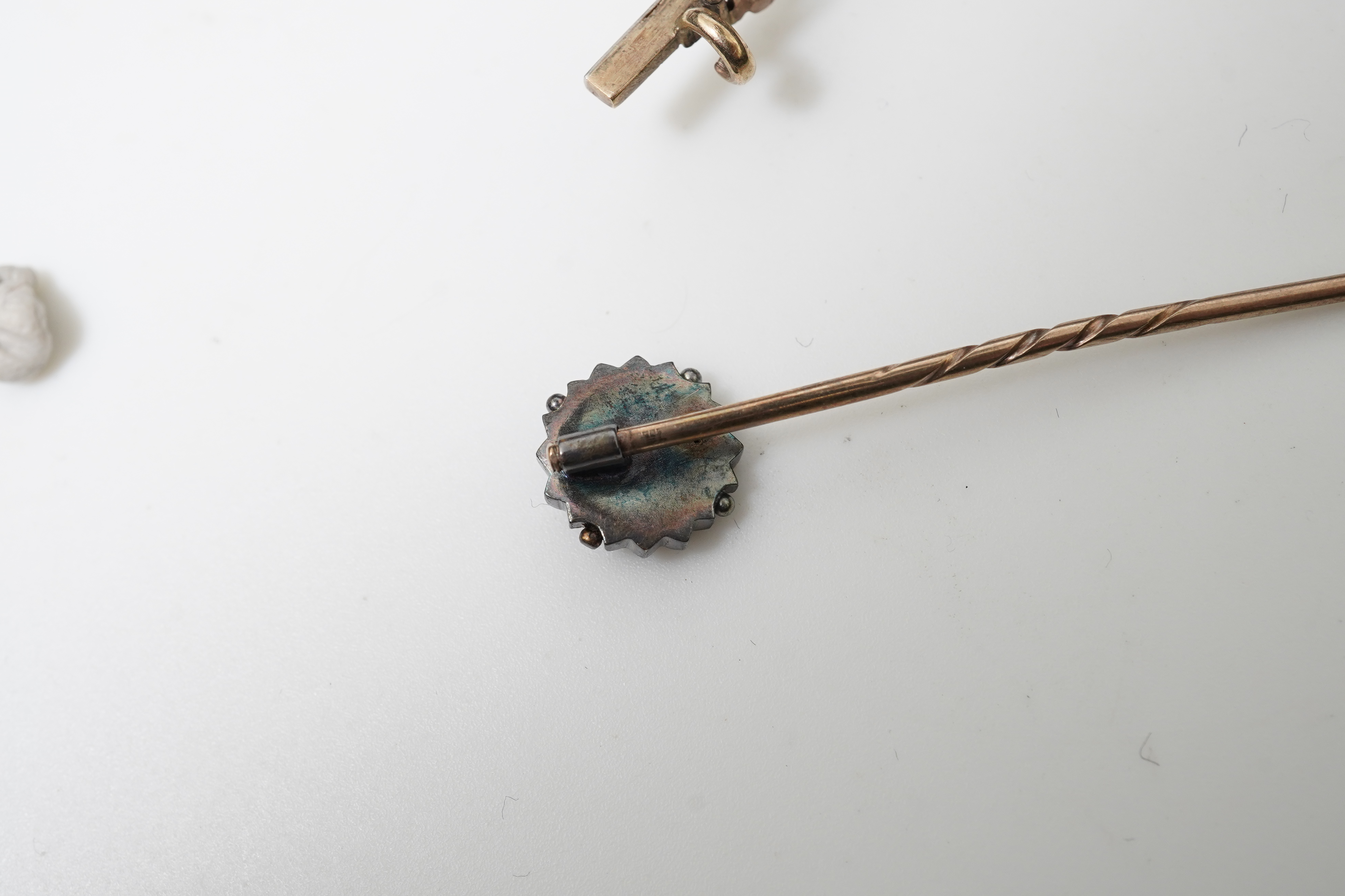 A bar brooch and a stick pin, late 19th/early 20th century